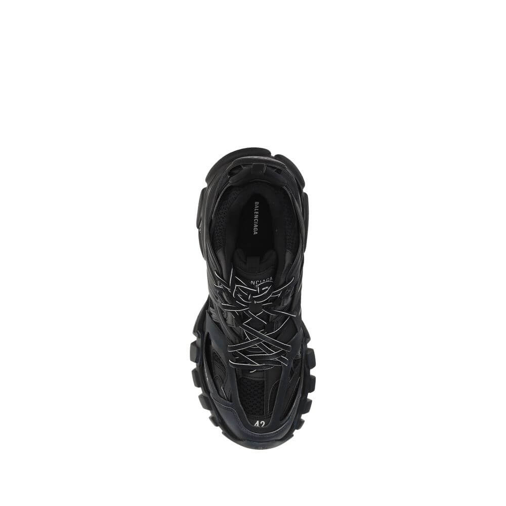 Top view of black athletic sneakers featuring lace-up closure and multi-layered design.