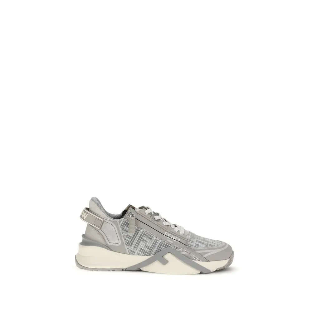 Gray athletic sneakers by Fendi with elastic laces, side zip, and wavy sole design.