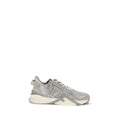 Gray athletic sneakers by Fendi with elastic laces, side zip, and wavy sole design.