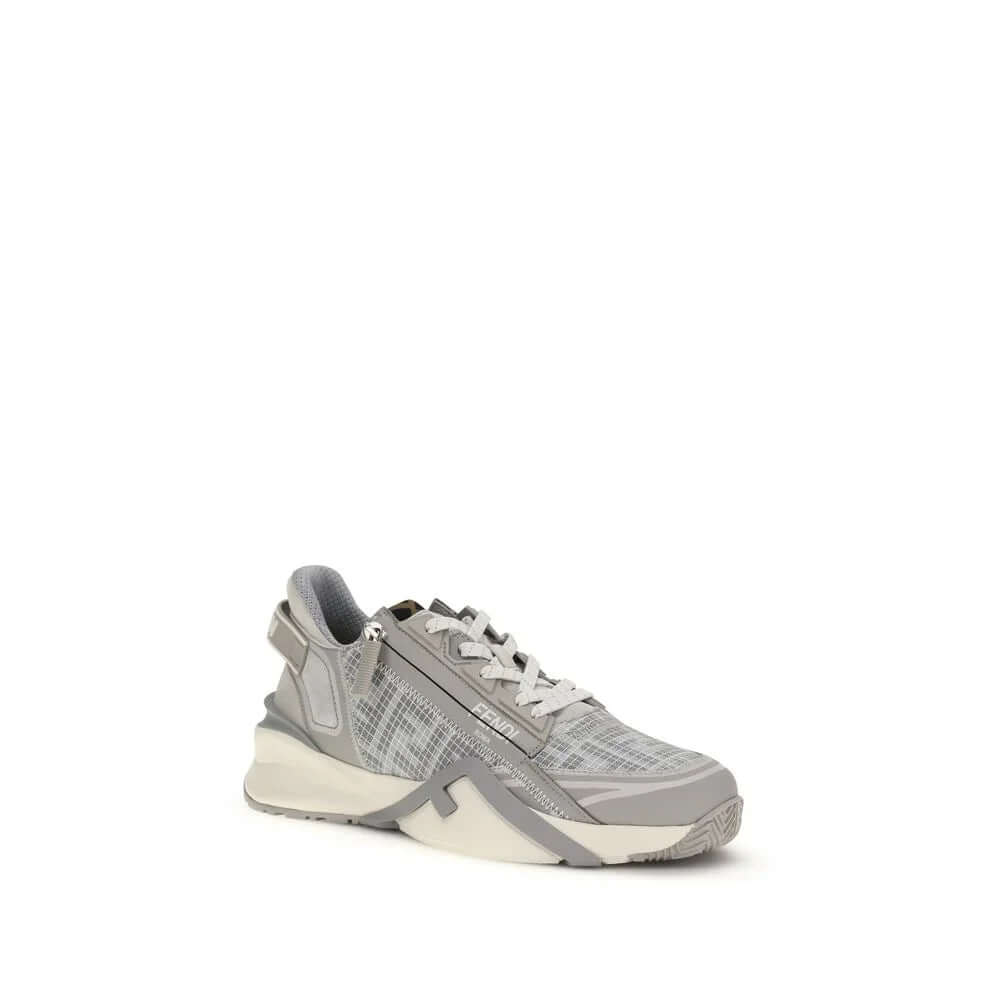 Gray athletic sneakers featuring slip-on design, elastic laces, and side zip for effortless wear.