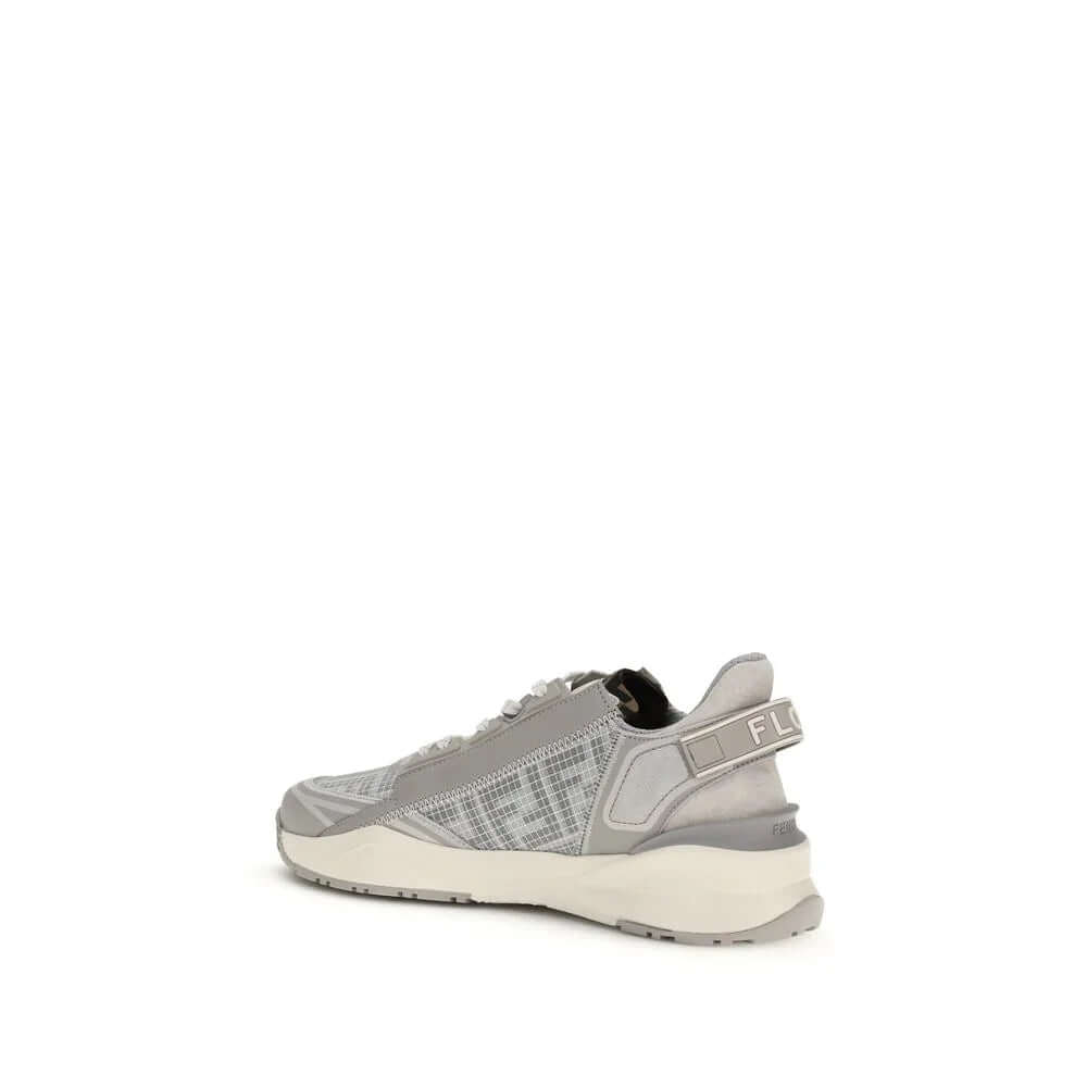 Gray athletic sneakers featuring elastic laces, wavy sole, and Fendi branding on the heel.