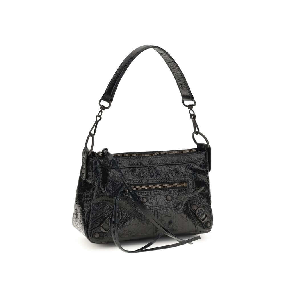 Elegant black lambskin shoulder bag with a unique textured finish and versatile strap.