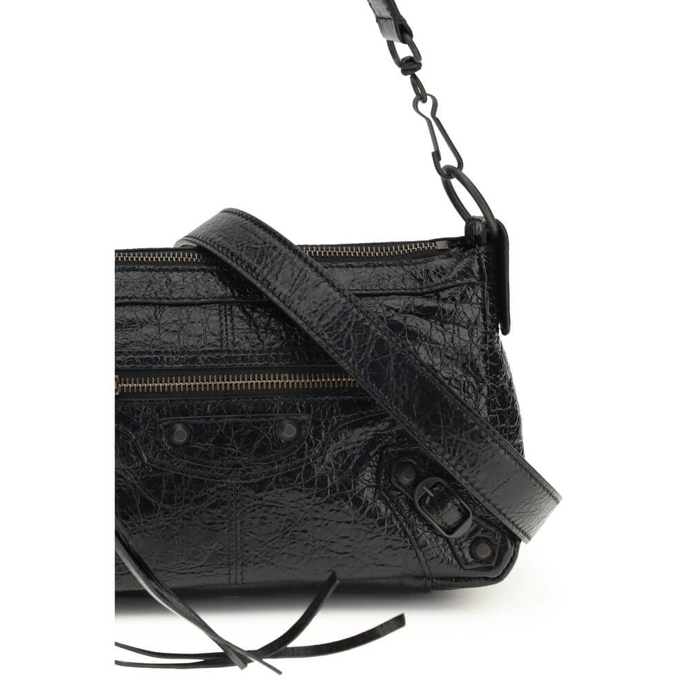 Black lambskin shoulder bag featuring textured details and a stylish strap.