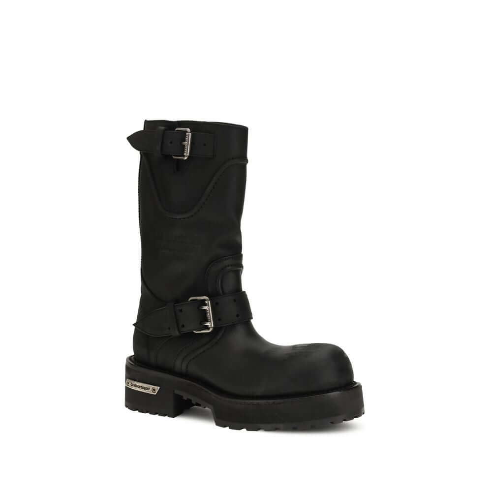 Black calf leather Balenciaga lace-up boots with buckle detail and rugged sole, perfect for urban fashion.