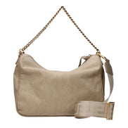 Beige fabric handbag with adjustable shoulder strap and gold chain detail.