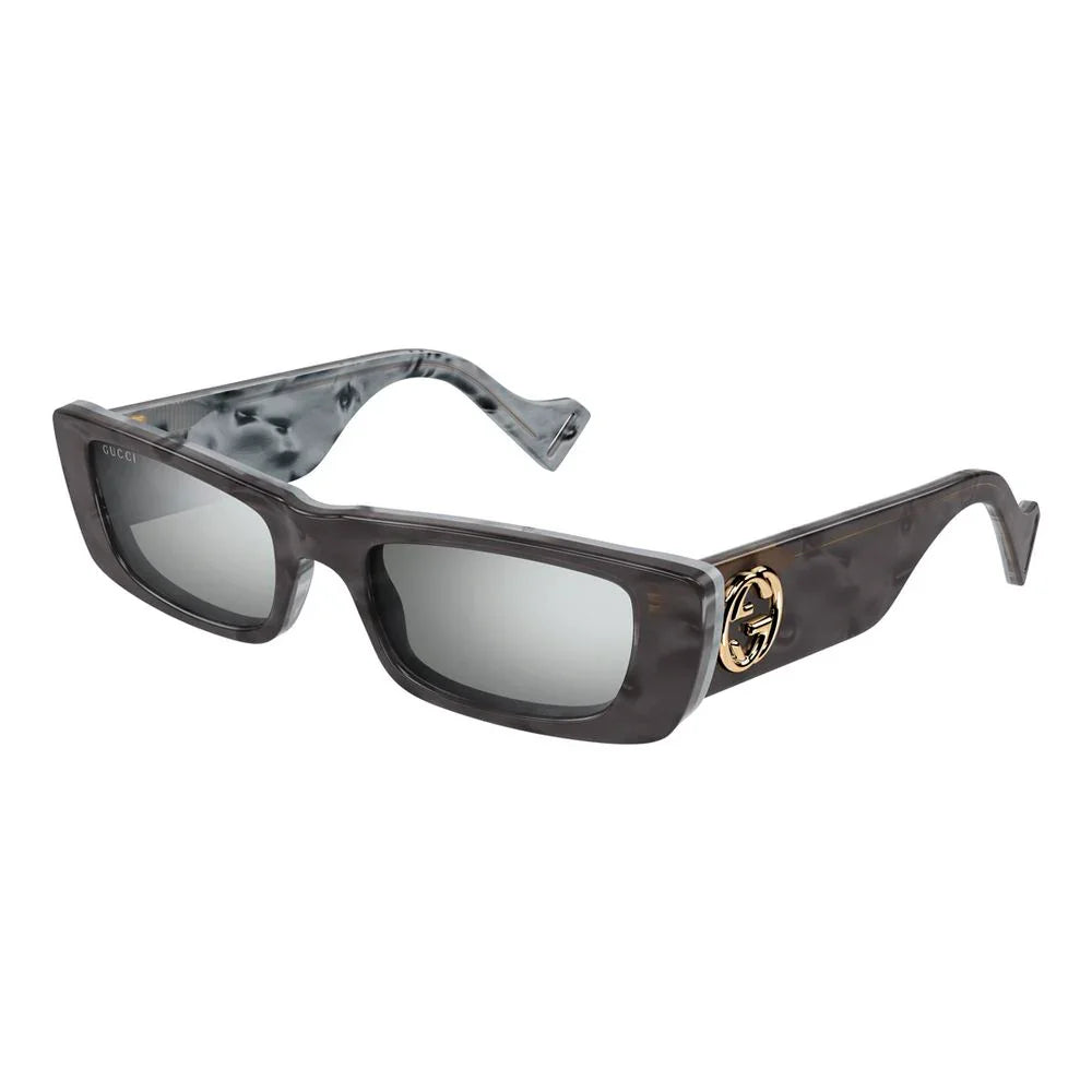 Brown acetate sunglasses by Gucci with gold logo accents, stylish eyewear for women.