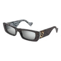 Brown acetate sunglasses by Gucci with gold logo accents, stylish eyewear for women.
