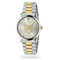 silver stainless steel dress watch with yellow gold accents and cat design on dial