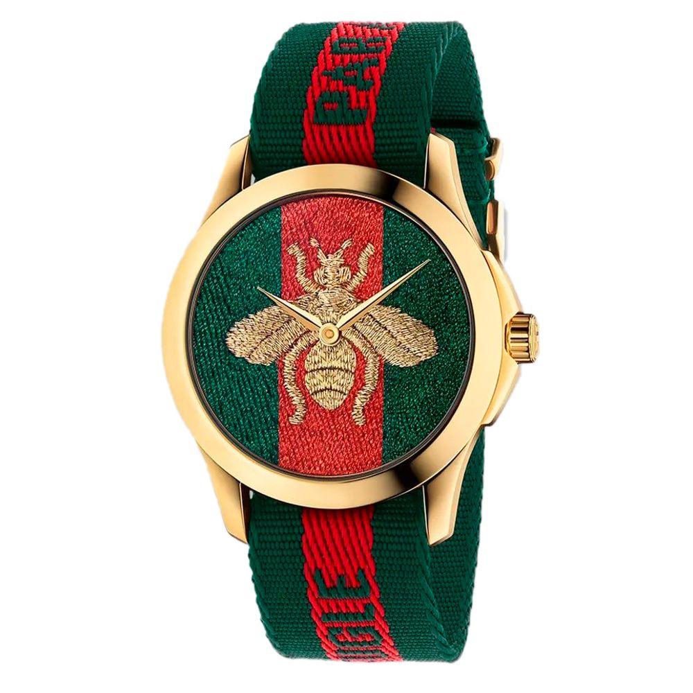 Multicolor nylon bracelet watch with a golden case and bee design on a vibrant dial.