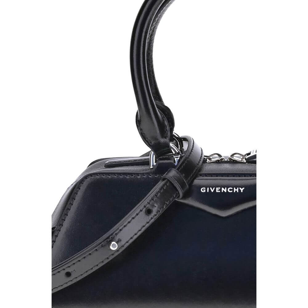 Close-up of a black calf leather handbag by Givenchy, showcasing its elegant design and structured details.