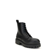 Black calf leather lace-up boots with a chunky sole and sleek design.
