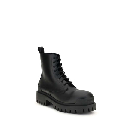 Black calf leather lace-up boots with a chunky sole and sleek design.
